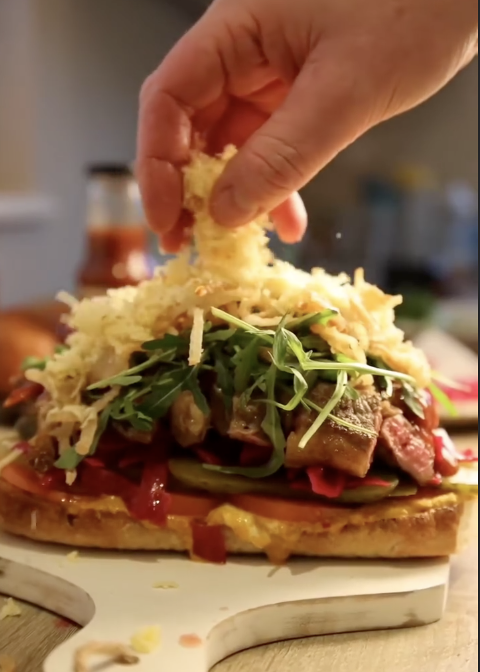 Building a loaded steak sandwich with The Indoor BBQ sauces